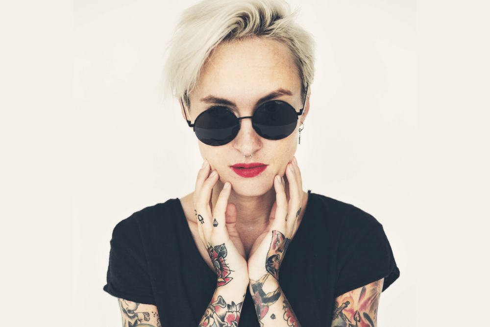 woman with sunglasses and tattoos